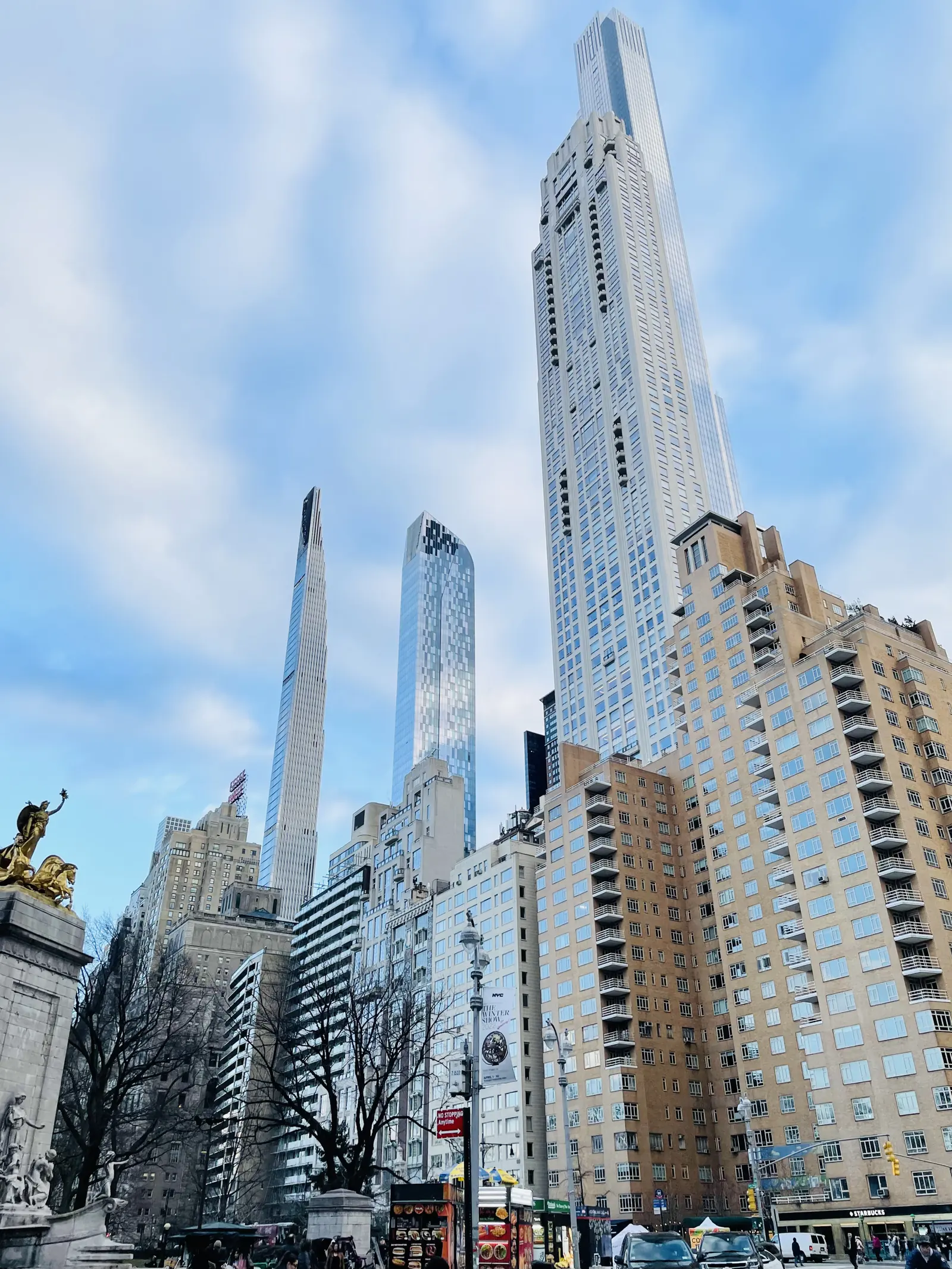 Slender towers rising above Columbus Circle at the corner of Central Park
