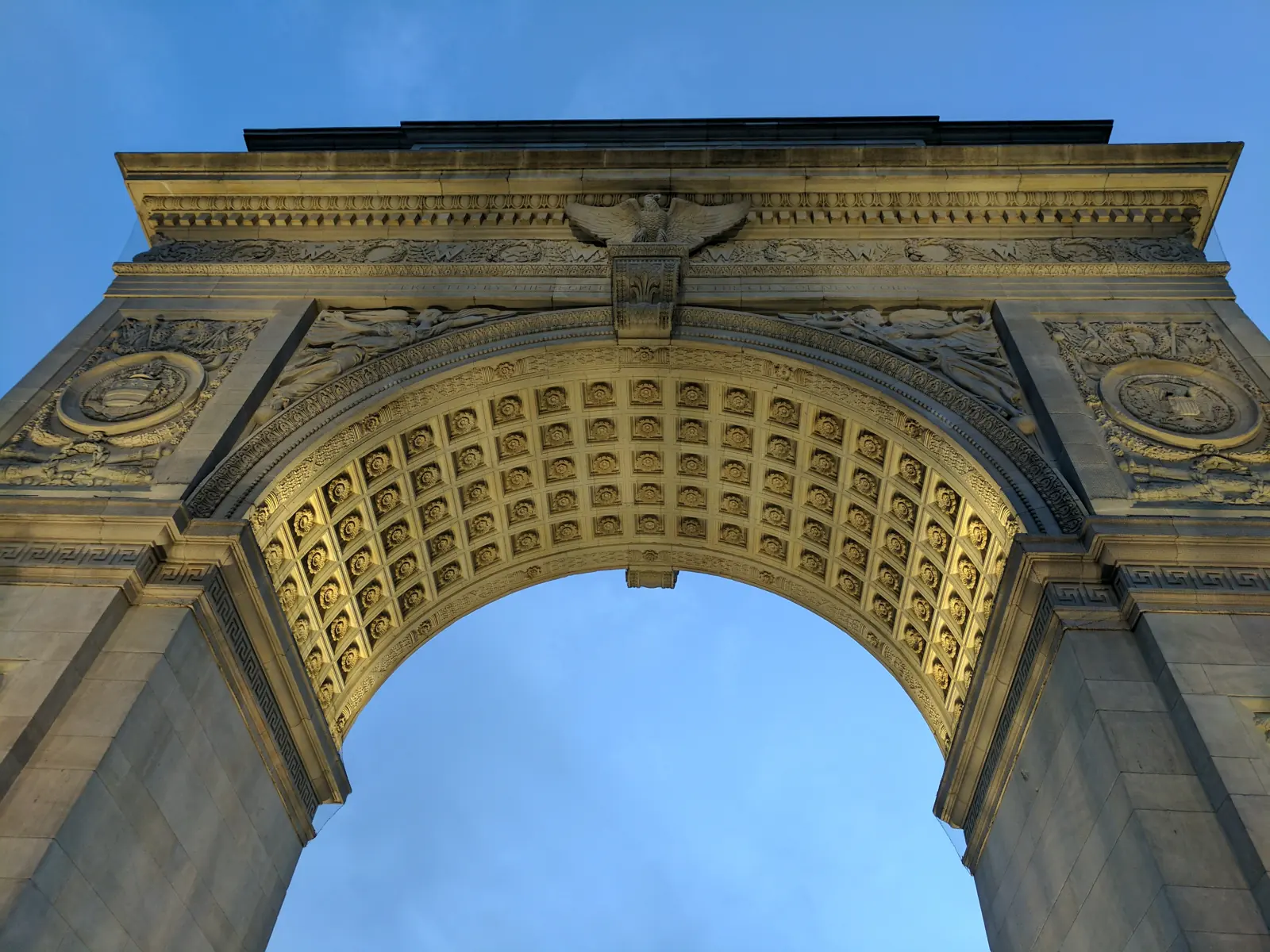 Looking up at the coffered underside of Washington Square Arch